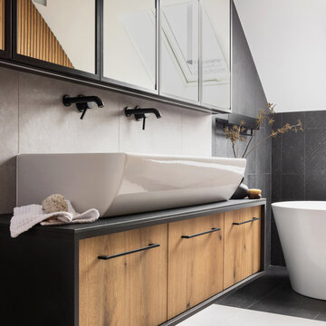 Modern Bathroom Interior with Sleek White Sink, Wood Cabinetry and Dark Accents for Contemporary Home Design