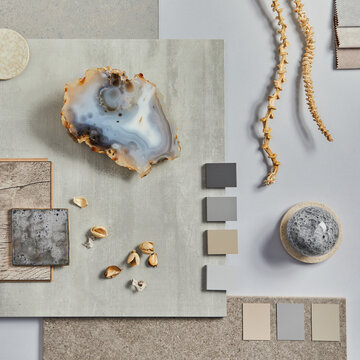 Natural design palette with agate, wood, stone, color swatches, and dried botanical elements