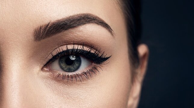 Cat eye eyeliner woman eye makeup lashes beauty cosmetics dramatic showing winged line concept for cosmetic advertising makeup tutorials fashion editorials salon services and glamour campaigns