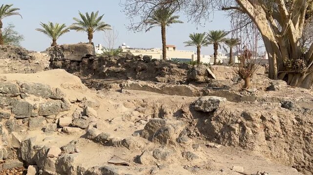 Stone ruins and protective grates at the historic othman well site.