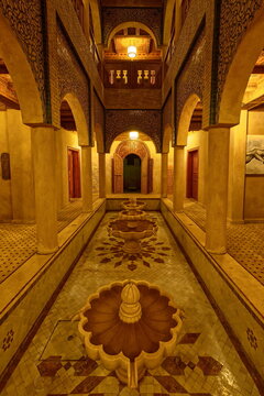 Courtyard with fountains of a modern, luxurious house in the Berber tradition of adobe wall, decorated in zellij and carved wood. Merzouga-Morocco-127