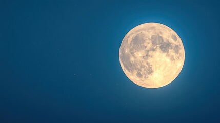 Fototapeta premium A luminous full moon shines brightly in the evening sky creating a serene atmosphere