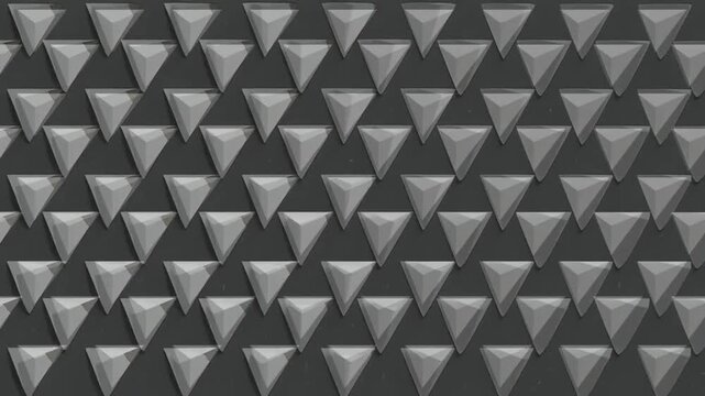 Realistic closeup camera looping abstract 3D animation of the moving grey solid triangles pattern rendered in 4K as motion background