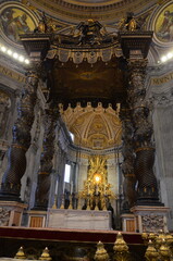 Rome, Italy 09.04.2020: Architectural details of the Dome (Cupola) and the Bernini's Baldacchino (baldachin or canopy) in St. Peter's Basilica (Papal Basilica of Saint Peter) © Denise Serra
