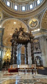Rome, Italy 09.04.2020: Architectural details of the Dome (Cupola) and the Bernini's Baldacchino (baldachin or canopy) in St. Peter's Basilica (Papal Basilica of Saint Peter)