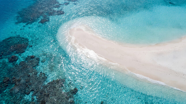 Aerial view of remote tropical sandbar in turquoise ocean water with tropical turquoise landscape paradise vacation isolated coastline environment outdoors