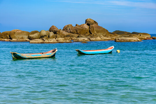 Rustic fishing canoes in the sea off Ilhabela, on the north coast of Sao Paulo