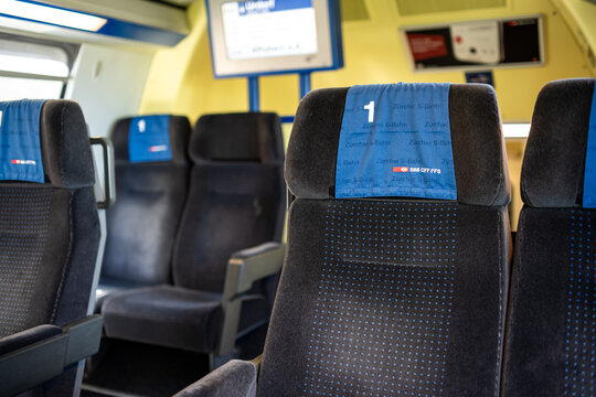 Zurich, Switzerland - July 10, 2026. Interior view of empty first class seats on a moving Swiss SBB CFF FFS passenger train
