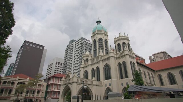 Saint Joseph Church architecture in Singapore city surrounded by modern skyscrapers showcasing historic Catholic heritage and vibrant urban travel destination in Asia