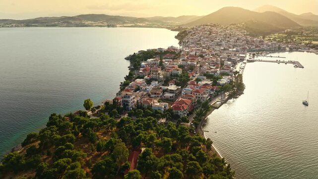 Breathtaking high angle view of Ermioni at Golden Sunset, Mediterranean village in Peninsula, Greece