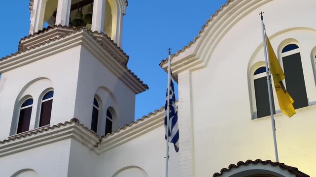 White Facade And Bell Tower Of St. Paraskevi Church In Paralia Katerini, Greece - Low Angle Shot