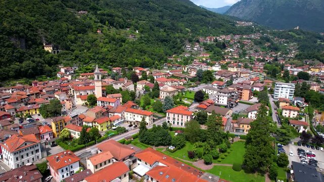 Porlezza Lake Lugano Italy 4K Drone. Aerial view of authentic lakeside village near Swiss border. Scenic Lombardy region alpine mountain landscape panorama beautiful destination b roll video asset