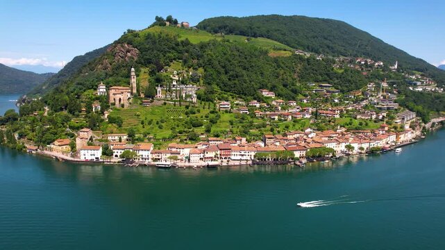 Cinematic Aerial Drone View of Morcote Village Lake Lugano Switzerland Speed Boat Crossing Scenic Waters  Lakeside Architecture and Alpine Mountains Most beautiful swiss villages Travel 4K footage