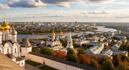 Obraz premium Aerial view of historic city with autumn foliage and river.