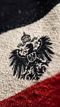 German Empire flag with imperial eagle emblem on textured fabric
