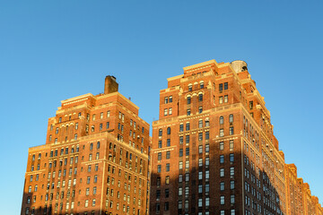 Classic Manhattan Brick Apartment Buildings at Golden Hour © Martin