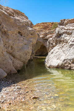 A pool of water near Nahal Rahaf-Rahaf Stream in the Judean Desert in Israel.
