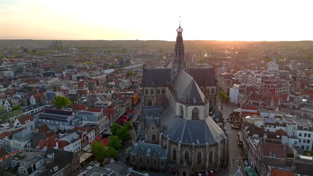 Aerial view on a Haarlem town, the former Capital of the Netherlands. Filming from the air with a drone at sunset Time