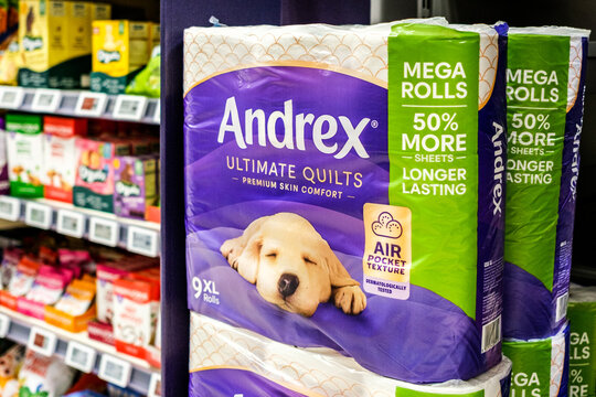 A Prominant Retail Shelf Display of Multi-Packs of Andrex Mega Rolls Ultimate Quilts Toilet Tissue In A Supermarket Aisle With No People
