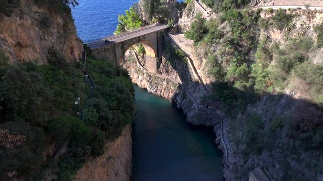 Aerial Shot of Fiordo di Furore, Fjord of Furore. Azure Water, Cliffs, Big Canyon, famous bridge in Amalfi coast, Italy