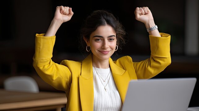 Young freelancer celebrates first payment notification while working in home office