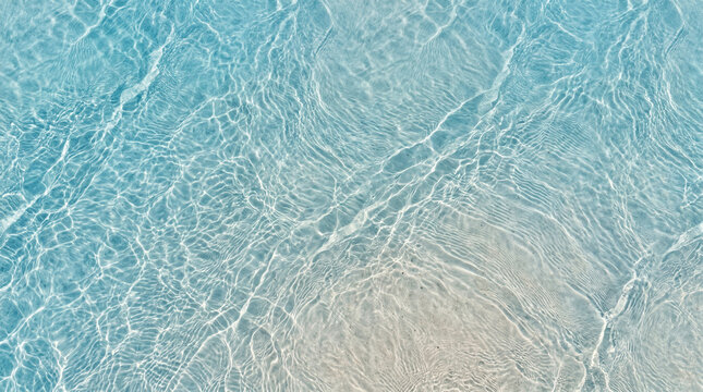 Clear turquoise ocean water texture over a sandy background
