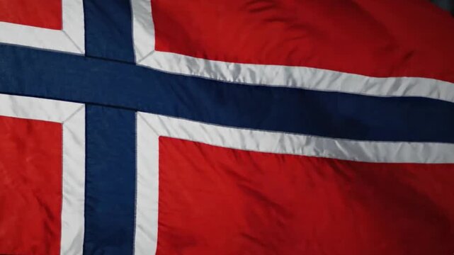 Closeup of the norwegian flag fabric texture waving