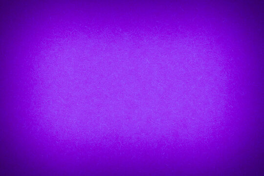 vibrant violet backdrop: close up of craft cardboard with illuminated center