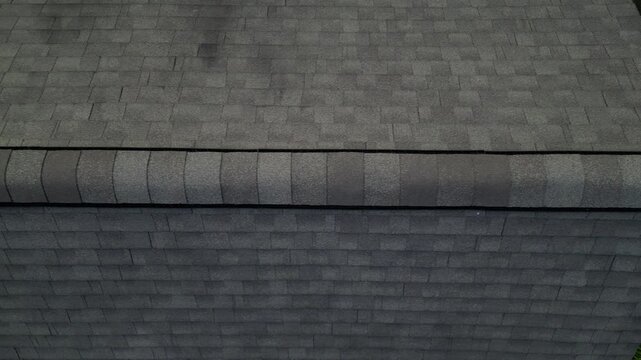 aerial view of rooftop shingles on roof of suburban rural house in upstate new york usa (chimney tiles trees sunset sun shine tone) countryside home roofing brick shale concrete asphalt fiberglass
