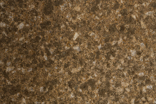 Old rustic granite rock texture background with small quartz crystals