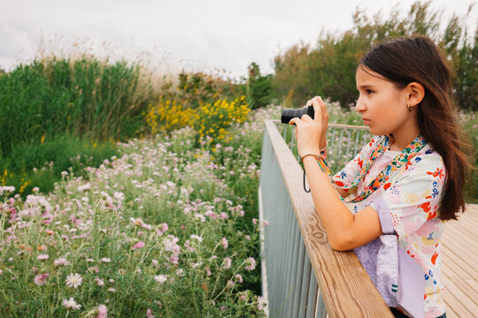 Girl Focusing Camera on Nature Trail. Barcelona, Spain