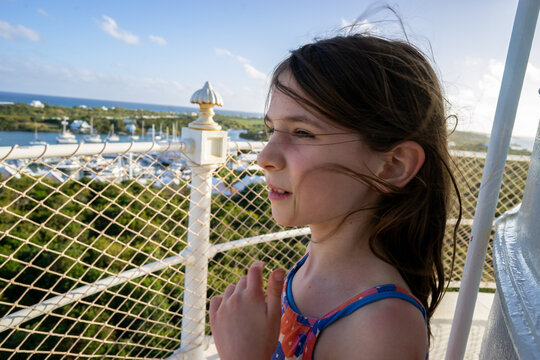 Child admires view from Elbow Reef Lighthouse in the Bahamas