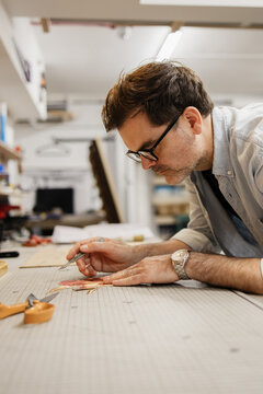 Artist working on art piece in studio workshop