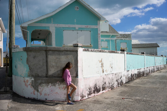 Girl stands on street in Green Turtle Cay, Bahamas