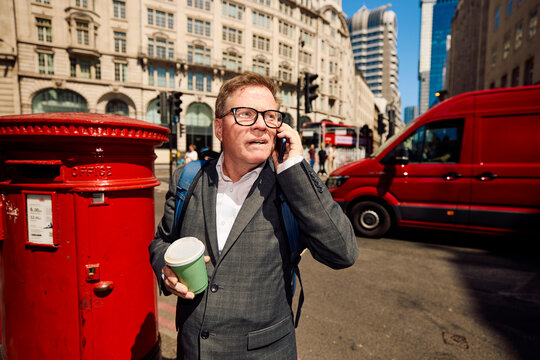 Businessman is on the phone in central London.