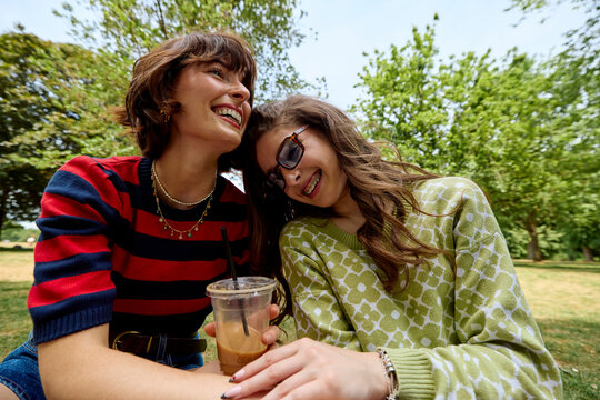 Mother and daughter share smiles outdoors