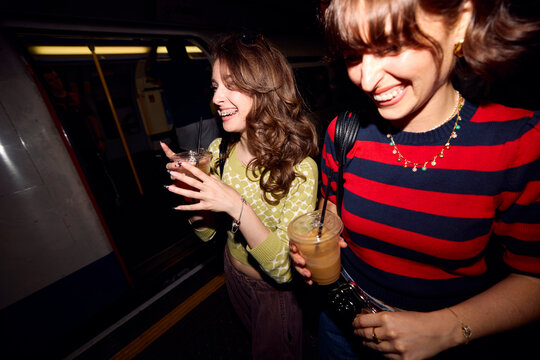 Women Have Fun in Subway Station