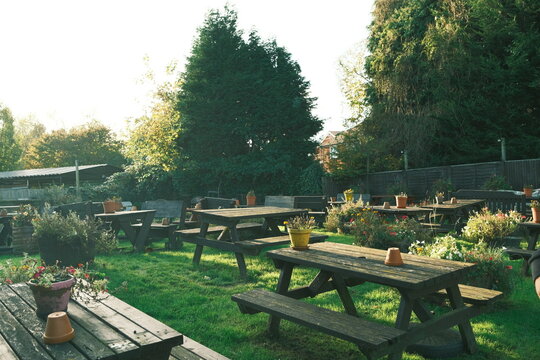 Garden Picnic Tables at Sunset
