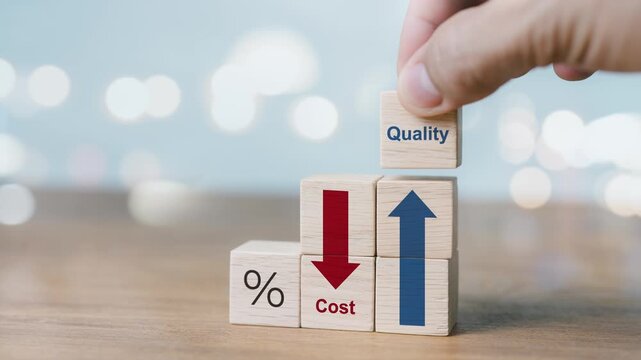 Close-up of a hand stacking wooden blocks to show Cost text with a decreasing red arrow and Quality text with a rising blue arrow, representing business budget optimization and value improvement.