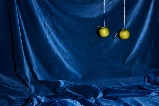 Two Green Apples Hanging Around