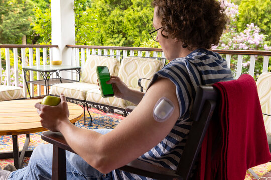 Cell Phone  App continuous glucose monitor Portrait man 