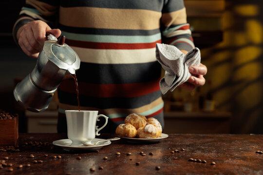 Profiteroles with mascarpone and cup of black coffee.