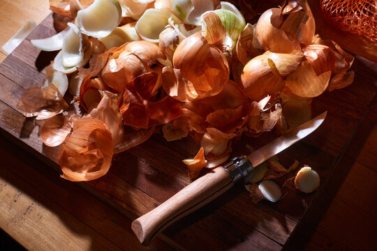 Onion Skins on a Wooden Board