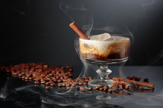 Cocktail of cream and coffee on a black background.