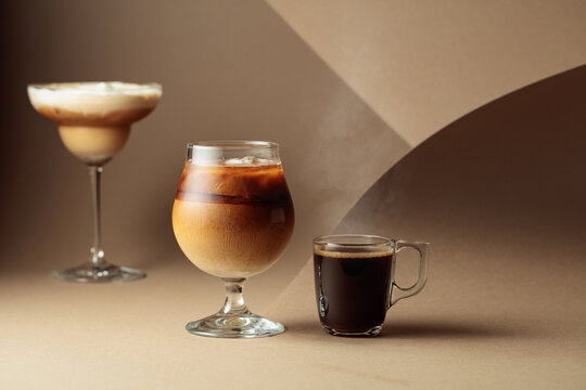 Black coffee and iced coffee cocktails on a beige background.