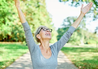 Happy active senior woman meditating and daydreaming and relaxing and nature outdoors © Lumos sp