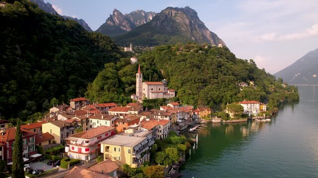 Cinematic Sunset Drone Reveal of San Mamete Village Valsolda Valley Lake Lugano Italy Romantic Lakeside authentic hidden gem Alpine Mountains Radiant Golden Hour Light Panoramic 4K Footage