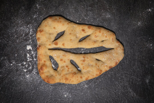 Fresh Homemade Proven&ccedil;al Fougasse Bread on Slate Board Top View