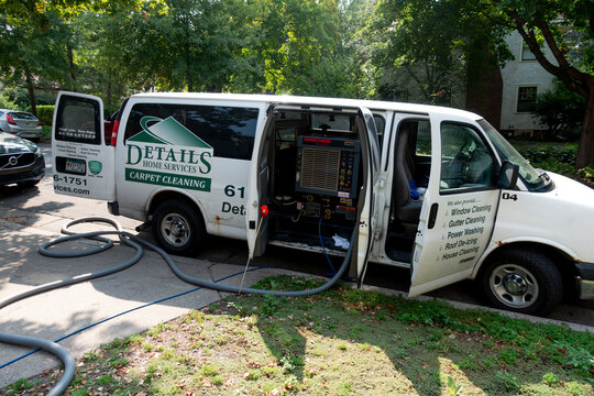 Van truck parked with various home cleaning services carpet windows. St Paul Minnesota MN USA
