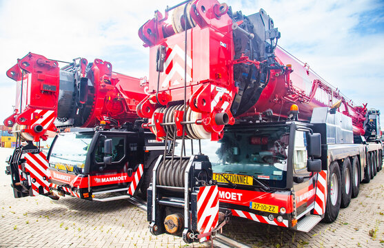 Amsterdam, Netherlands - June 4, 2026: Front close up view of heavy mobile cranes Liebherr of Mammoet company parked at a terminal industrial port